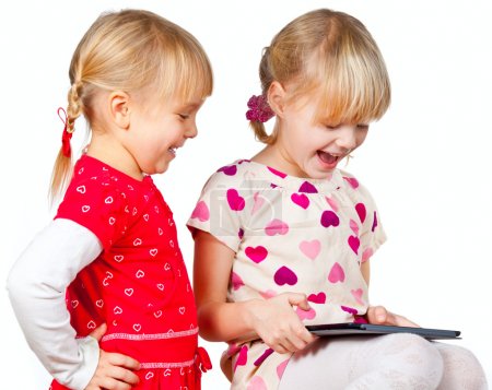 Children playing with a tablet computer