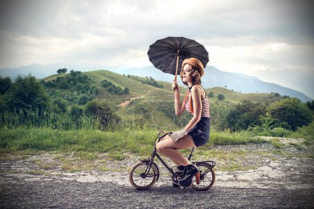 Woman riding a small bike