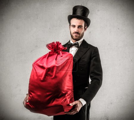Handsome man holding a present