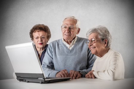 Old people looking at a laptop