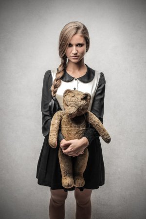 Scary girl with a teddy