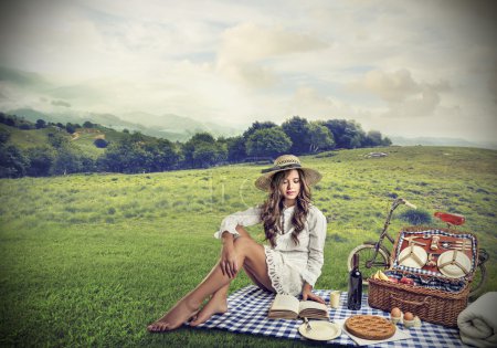 Young woman having a pic nic