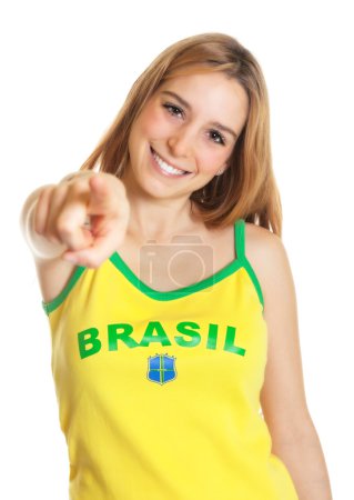 Brazilian sports fan pointing at camera