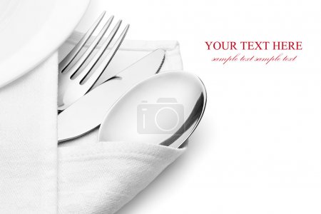 Knife, fork and spoon with linen serviette.