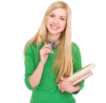 Smiling student girl with books and pen