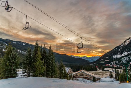 Empty Ski Lift Chairs At Sunrise