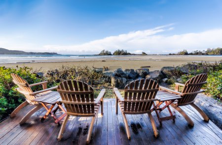 Four Chairs on Deck Overlooking Beach