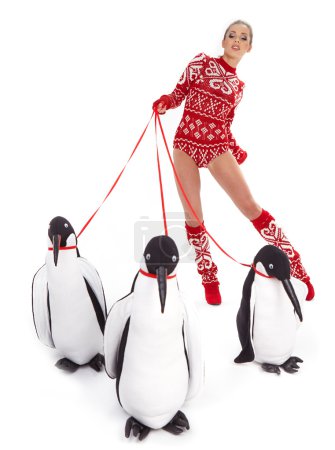 Winter woman walking with penguins