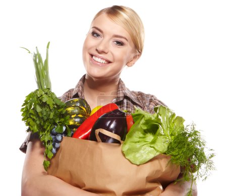 woman holding a shopping bag full of groceries, mango, salad, r