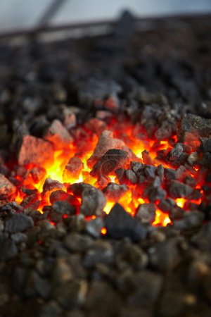 Old-fashioned blacksmith furnace with burning coals