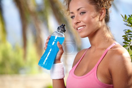Sporty woman with bottle of water