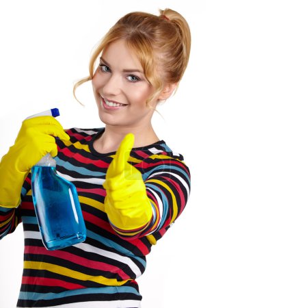 Woman as a cleaning maid holding liquids and showing OK sign