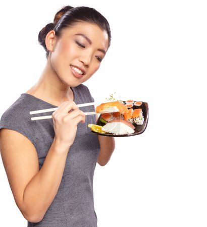 Woman with a plate of sushi