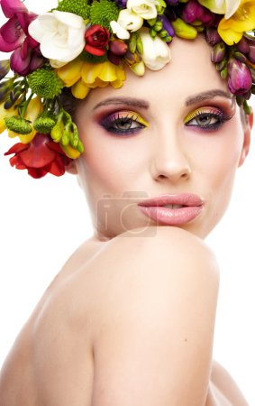 Woman with hairstyle and freesia flower. Isolated.