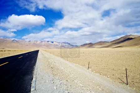 yellowish mountain road view in tibet of China