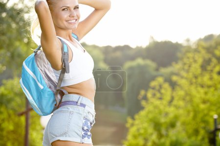beautiful girl hiking outdoors leading a healthy lifestyle