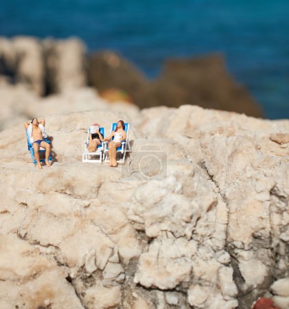 Miniature couple at beach