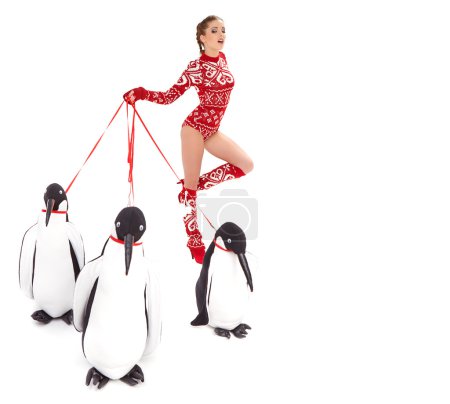 Winter woman walking with penguins