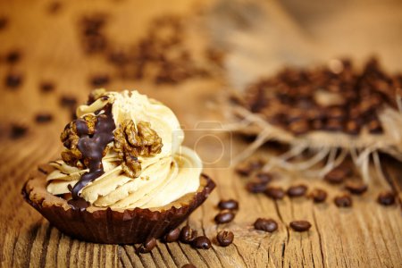 chocolate cupcake on old wooden table