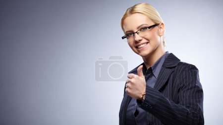 Business woman with thumbs up gesture