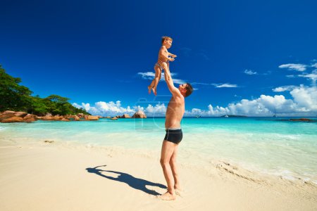 Father and   boy  on beach