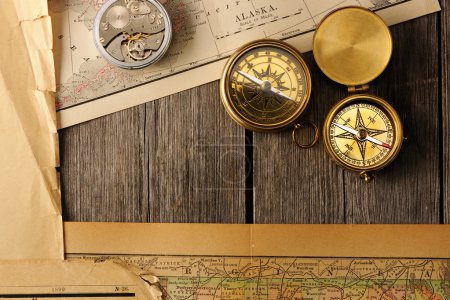 Antique compasses over old map