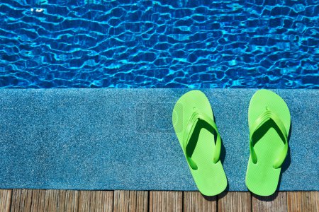 Slippers by a swimming pool