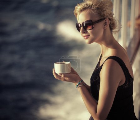 Beautiful girlresting woman with cup of coffee