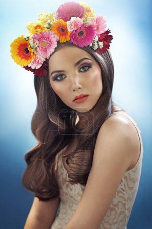 Young pretty girl with the flower hat