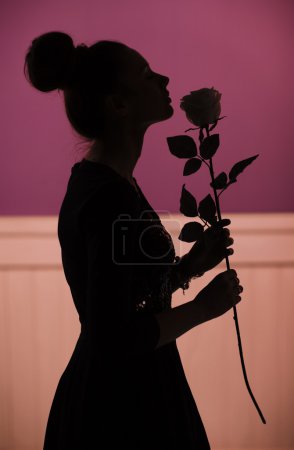 Woman with the fragrant rose