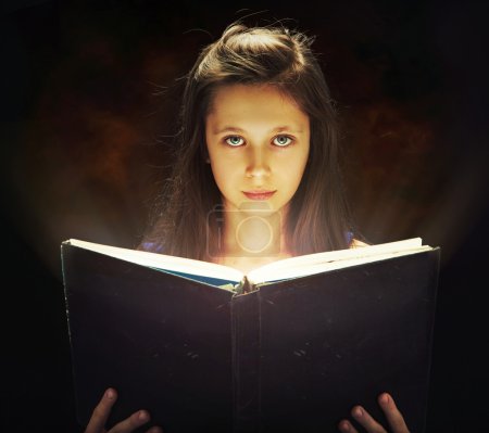 Girl opening the magic book