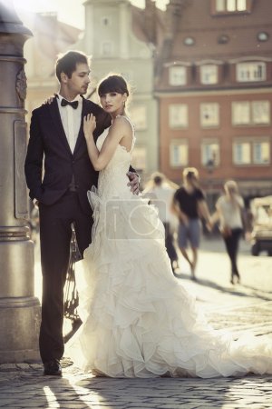 Young attractive marriage couple in the old town