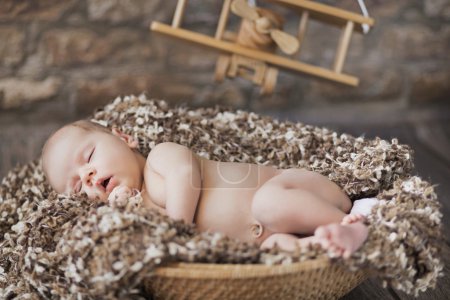 Fine picture of baby sleeping in toy room