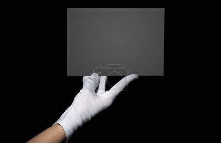 Female hand holding grey board