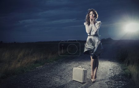 Retro woman with suitcase