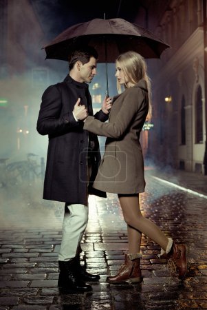 Picture presenting couple during autumn evening