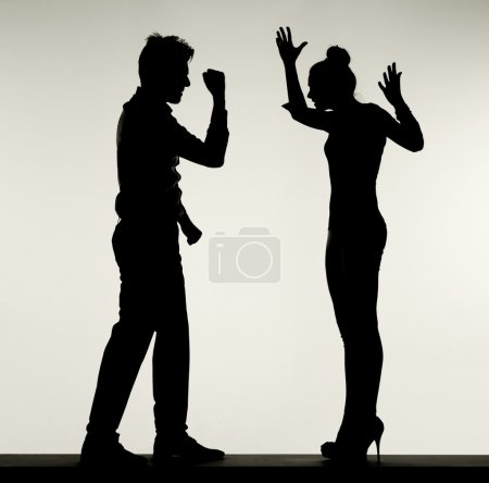 Silhouette of arguing couple