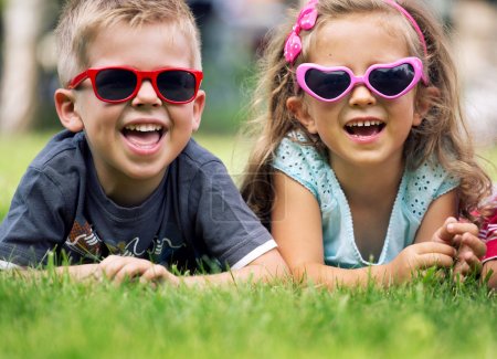 Cute small kids with fancy sunglasses