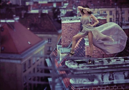 Fantastic photo of woman standing on the roof