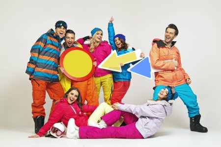 Colorful photo of the glad snowboarders