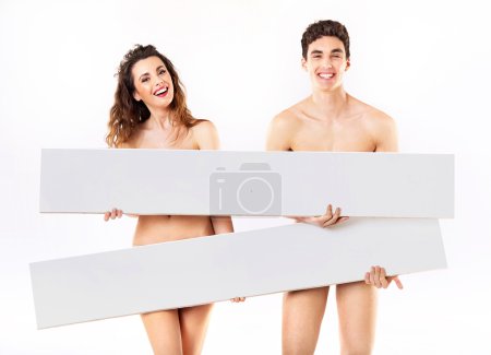 Laughing nude couple with empty adverts