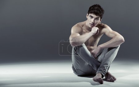 Athlete young man in sexy pose