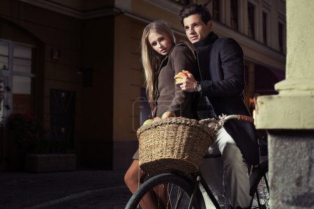 Great couple riding oldfashion bicycle