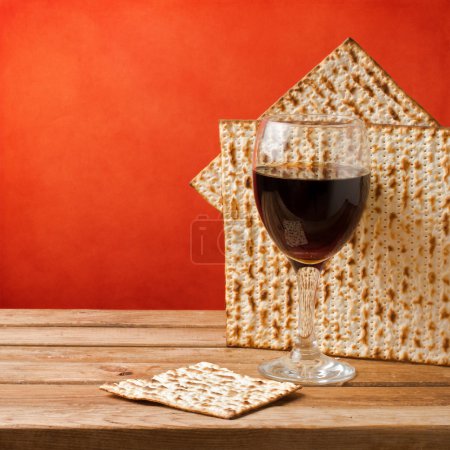 Background with glass of wine and matza for passover celebration