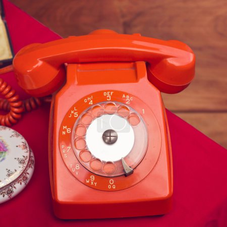 Vintage rotary telephone on table