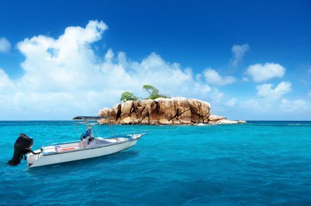 speed boat and island at Seychelles