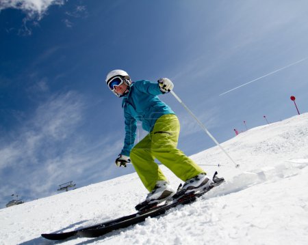 Skiing - woman skiing downhill