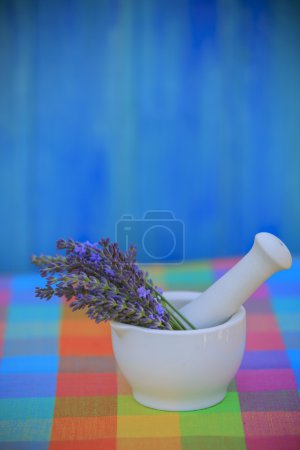 Lavender herbs in a mortar, healthy cosmetics concept