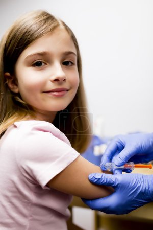 Vaccine - a doctor giving  vaccination girl, health, prevention