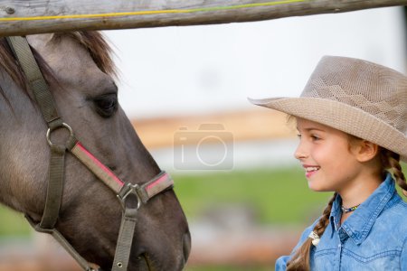 Ranch - Lovely girl with horse on the ranch